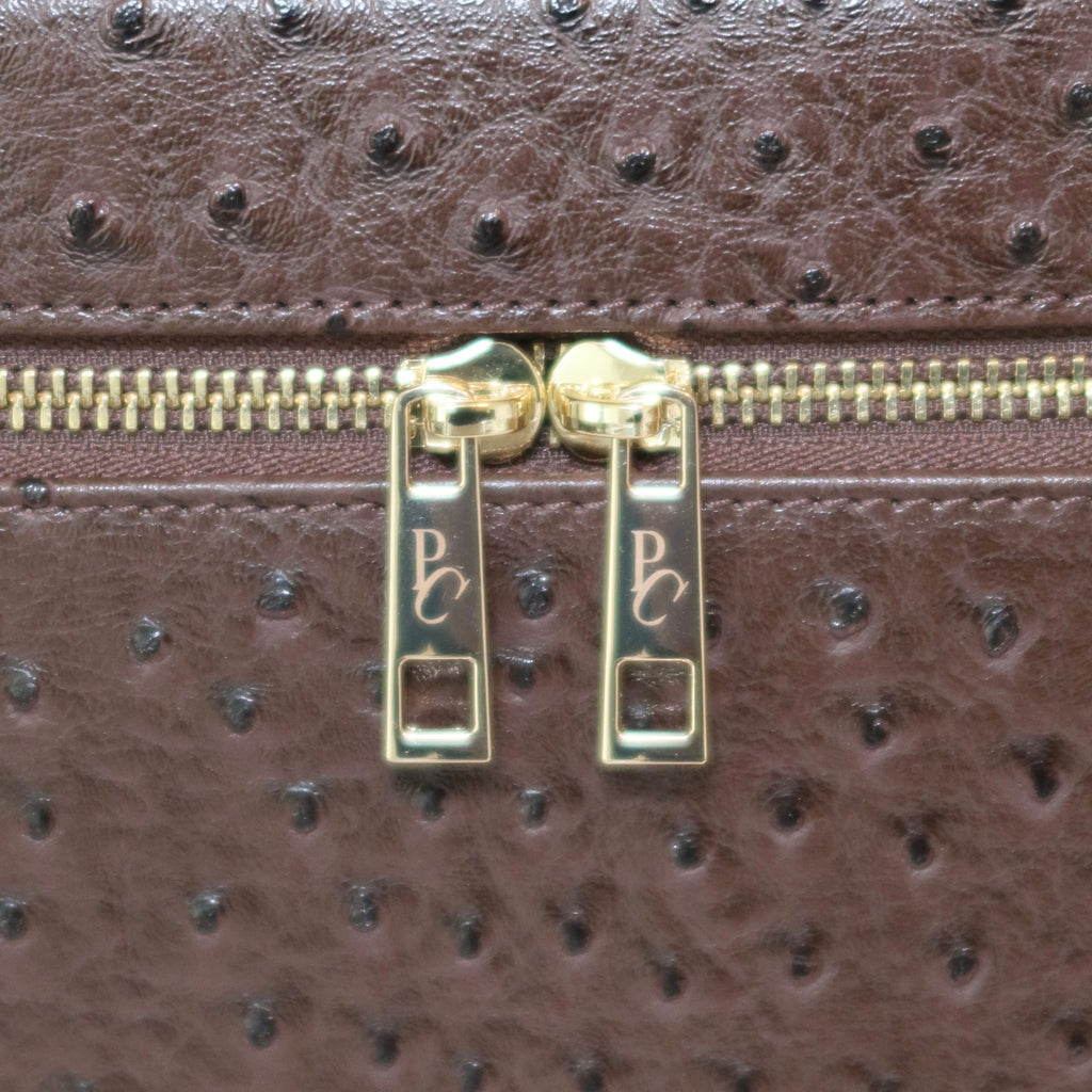 The Vanity Case – Travel Makeup Bag & Cosmetic Case with Ostrich Leather - Clove PIQUÉ CASES