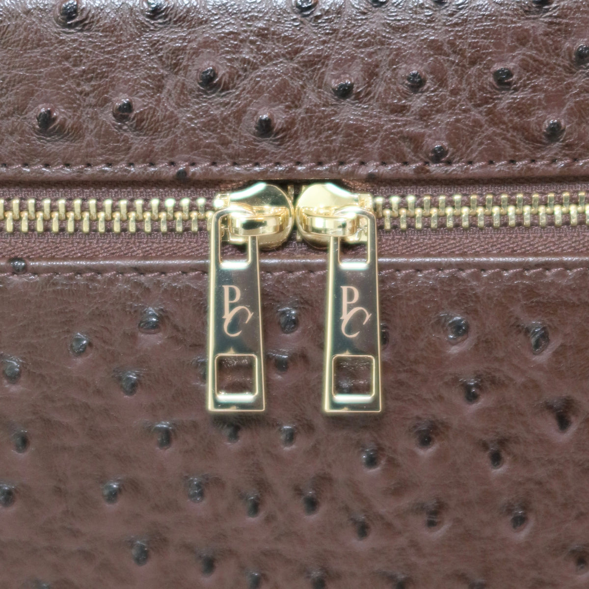The Vanity Case – Travel Makeup Bag & Cosmetic Case with Ostrich Leather - Clove PIQUÉ CASES